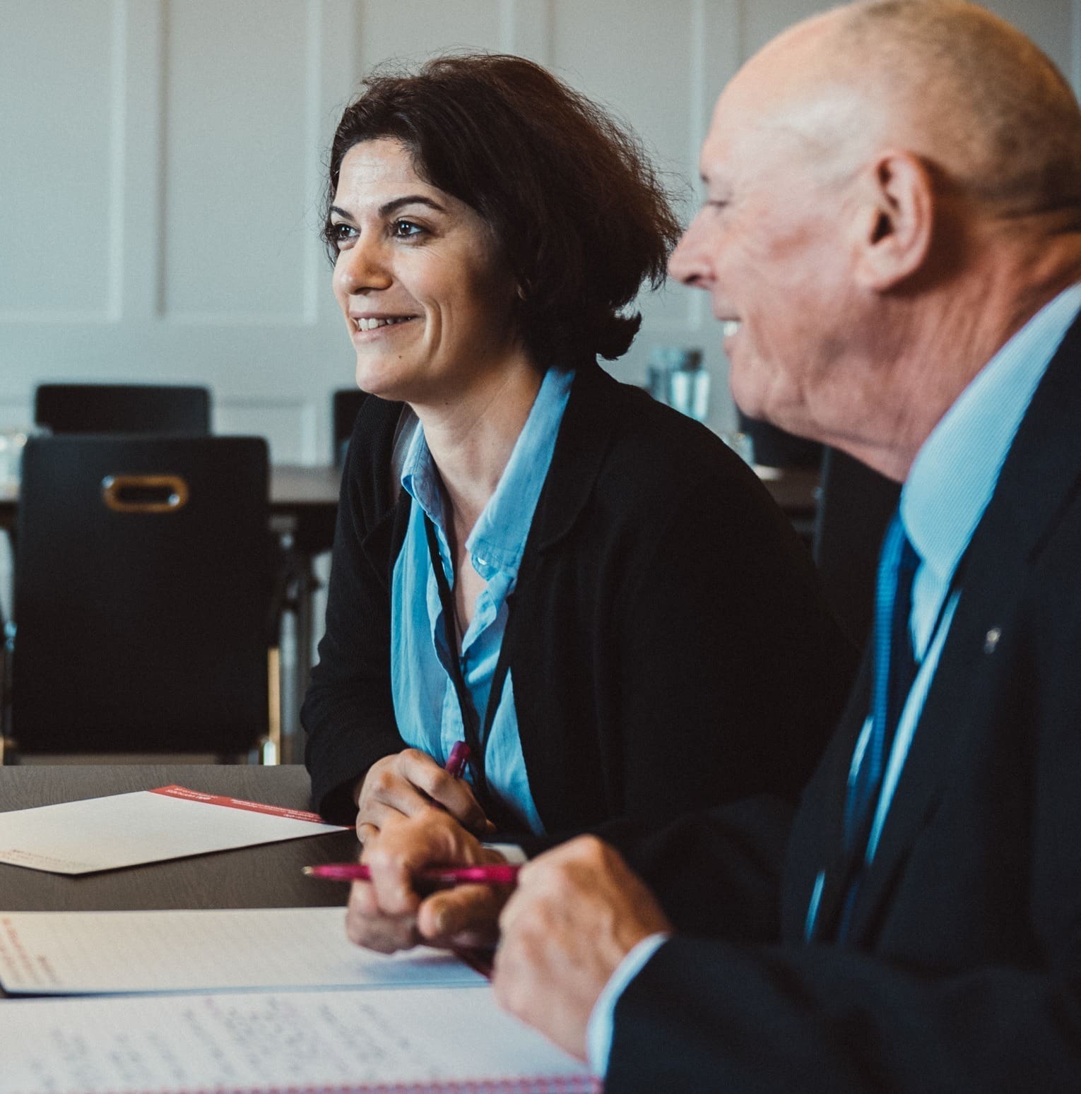 Male and female business people talking in a meeting