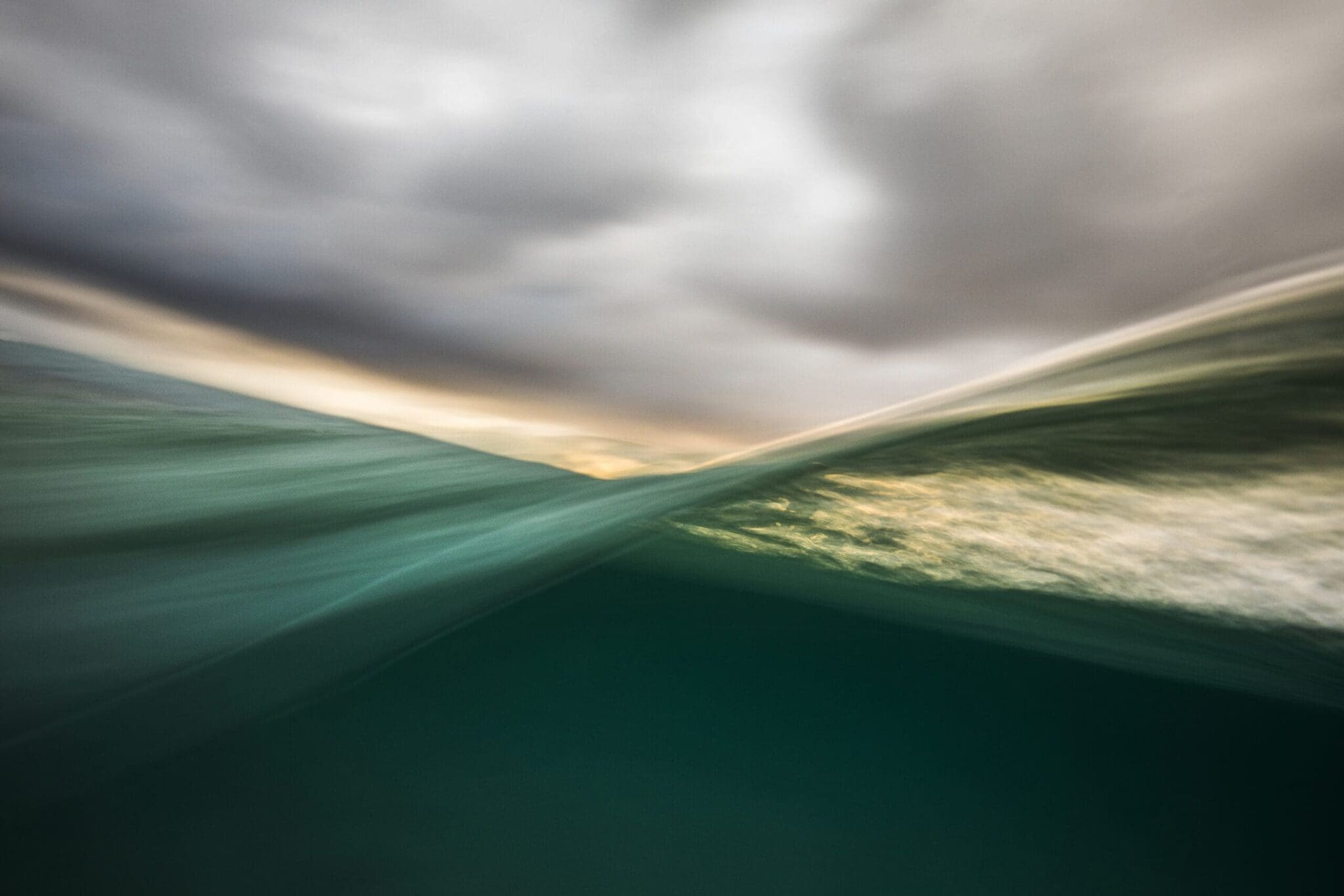 Turquoise abstract image representing sea water and a cloudy sky