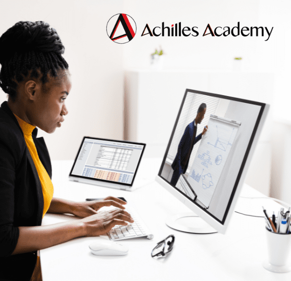 Achilles Academy Professional Training Courses. lady looking at a computer 