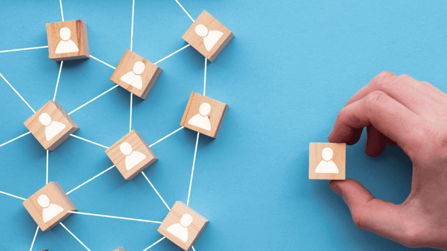 wooden style scrabble pieces with an outline of a head and shoulders on each