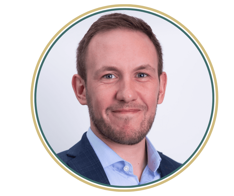 head shot of Adam Whitfield in a circle frame with green and gold borde