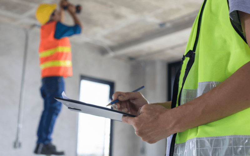 Construction site and auditor in foreground