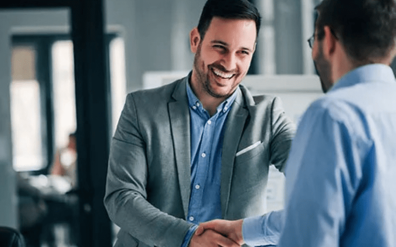 Business men shake hands to secure a deal