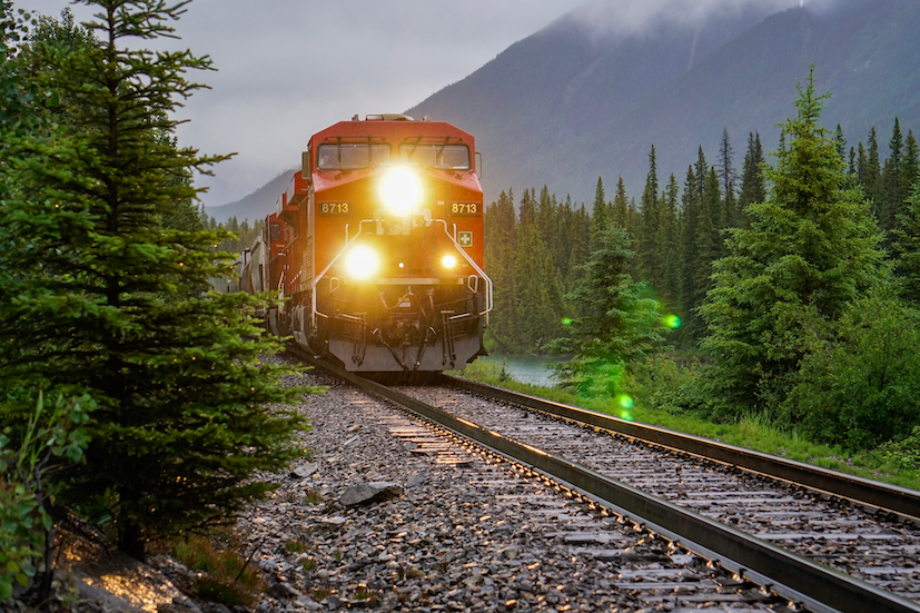 Train with lights on symbolising increasing supply chain and contractor risk in the rail industry