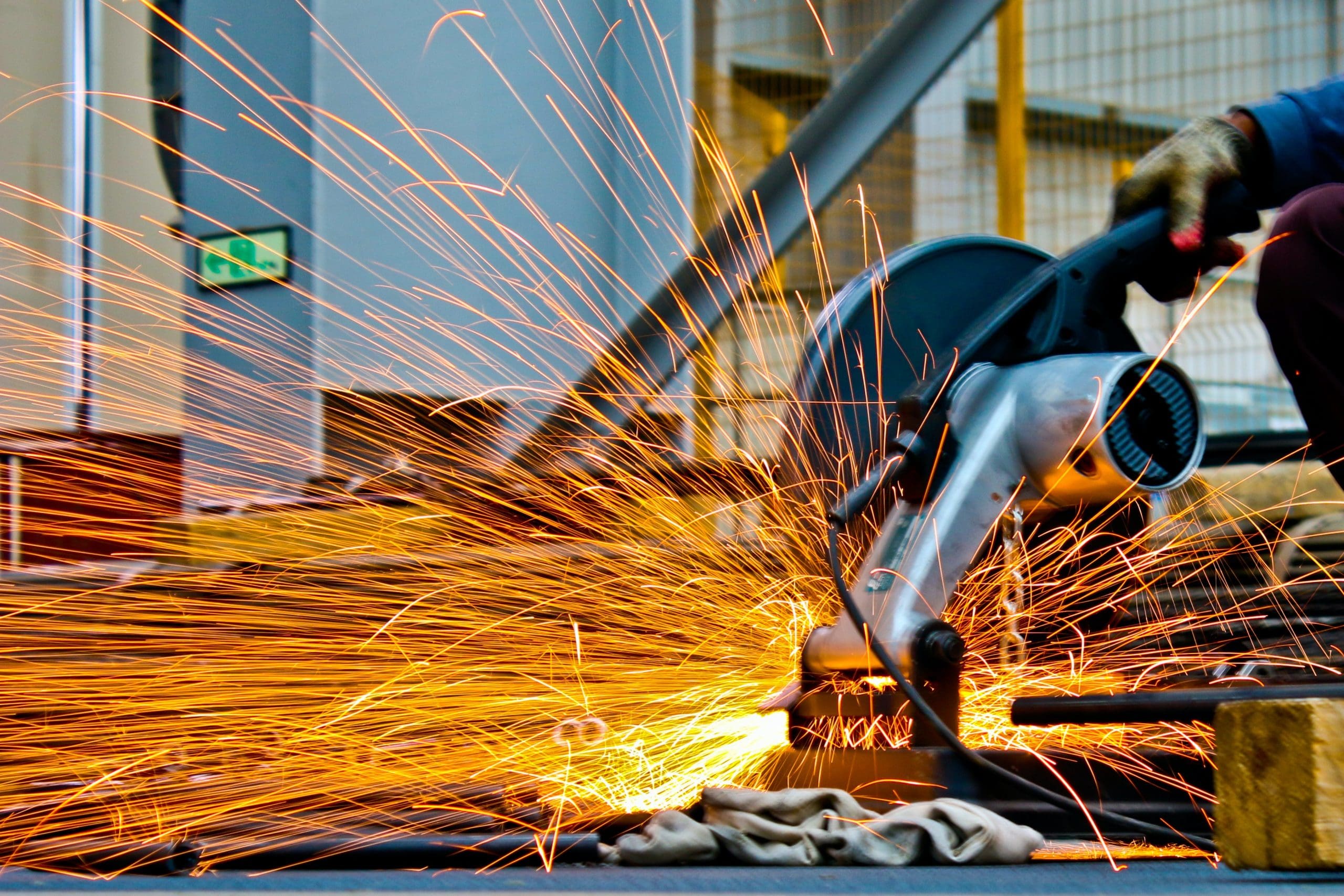sparks flying from saw in services and industry