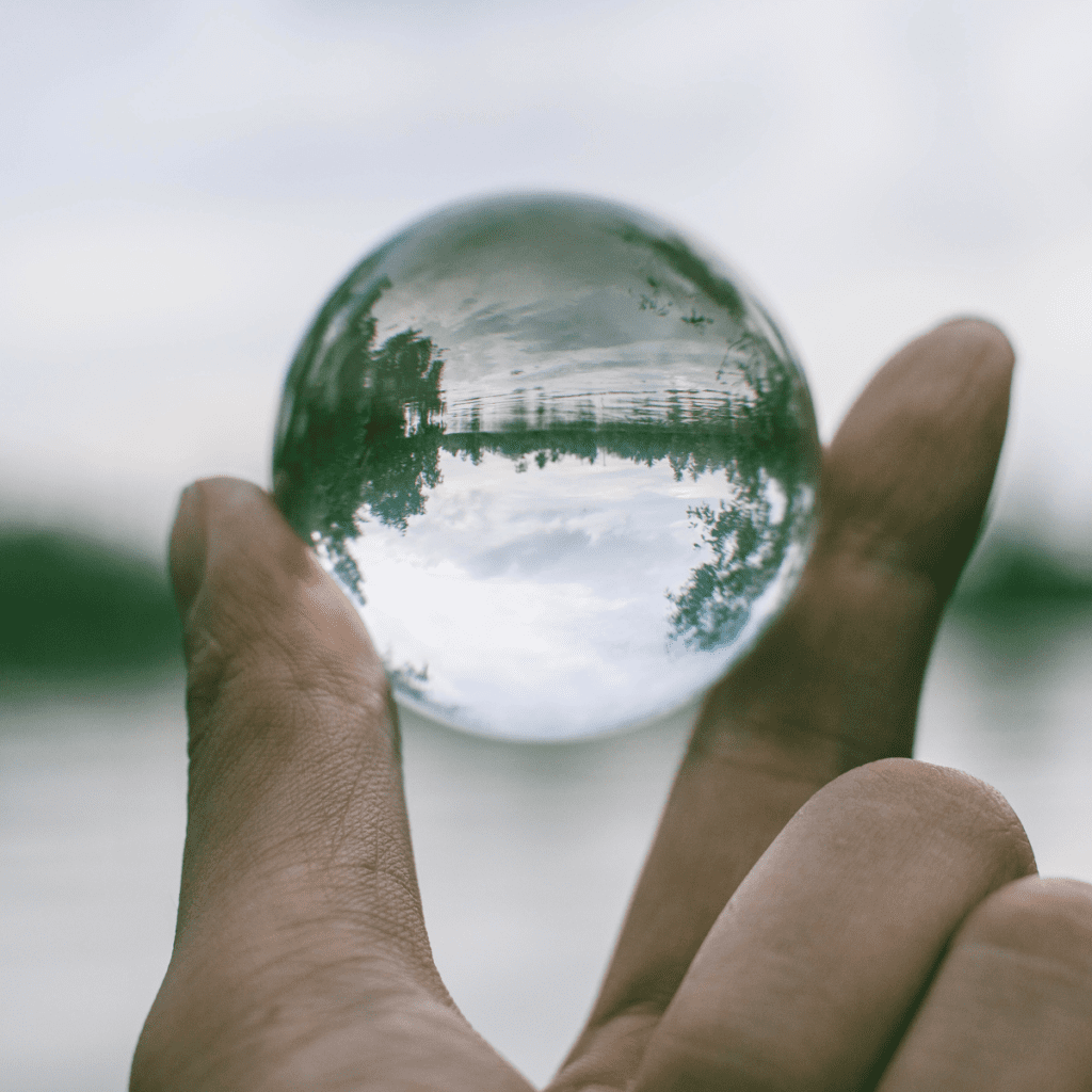 person holding up globe representing transparency